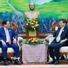 Thủ tướng Phạm Minh Chính hội kiến Tổng Bí thư, Chủ tịch nước Lào Thongloun Sisoulith. (Ảnh: Dương Giang/TTXVN)