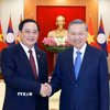 Tổng Bí thư, Chủ tịch nước Tô Lâm tiếp Thủ tướng Lào Sonexay Siphandone. (Ảnh: Thống Nhất/TTXVN)