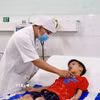 Sau 14 ngày được điều trị tích cực tại Bệnh viện Nhi đồng Đồng Nai, bé Đ.M.T đã hồi phục sức khỏe. (Ảnh: Lê Xuân/TTXVN)