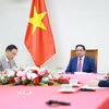 Thủ tướng Phạm Minh Chính điện đàm với Thủ tướng Malaysia Anwar Ibrahim. (Ảnh: Dương Giang/TTXVN)