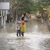 Buôn Nu, xã Uar (tỉnh Gia Lai) vẫn ngập sâu trong nước sau bão số 13. (Ảnh: Hoài Nam/TTXVN)