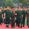 Phó Thủ tướng, Bộ trưởng Quốc phòng Việt Nam, Lào, Campuchia đến theo dõi buổi diễn tập. (Ảnh: Trọng Đức/TTXVN)