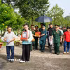 Hội Hỗ trợ gia đình liệt sỹ thành phố Đồng Nai phối hợp với Sở Nội vụ thành phố, Hội Cựu chiến binh và thân nhân gia đình liệt sỹ Trần Hữu Quân thực hiện di quách, tiễn đưa liệt sỹ về an táng tại quê hương. (Ảnh: Lê Xuân/TTXVN)