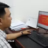 Từ số hóa hồ sơ, tổ chức lại quy trình tiếp nhận đến giải quyết thủ tục không phụ thuộc địa giới hành chính, hiệu quả ngày càng được nhìn bằng những kết quả cụ thể. (Ảnh: Hữu Duyên/TTXVN)