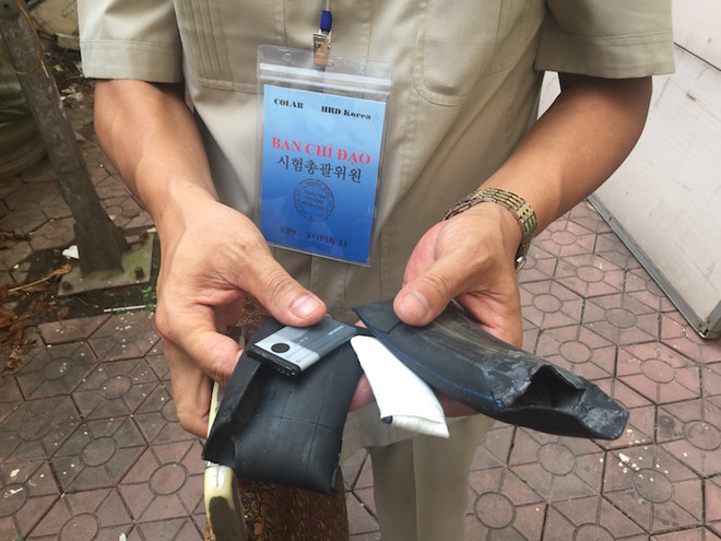 [Photo] Phát hiện điện thoại bọc cao su ném cho thi sinh thi tiếng Hàn ảnh 7