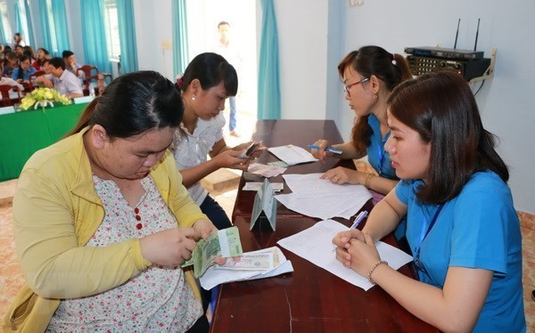 (Ảnh minh họa: Dương Chí Tưởng/TTXVN) Ai được hỗ trợ tiền mặt do khó khăn vì COVID-19 theo Nghị quyết số 68? ảnh 1