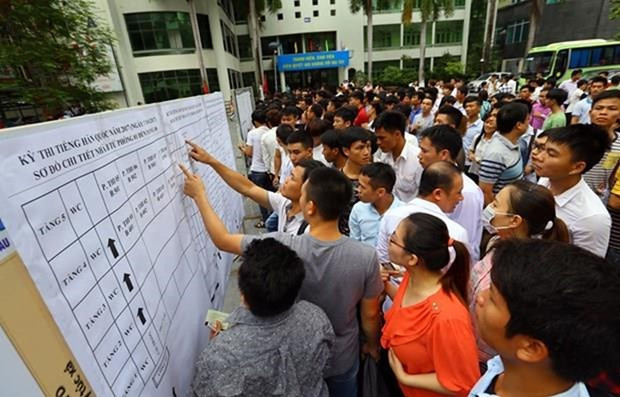 Người lao động tham gia kỳ thi tiếng Hàn để sang Hàn Quốc làm việc. (Ảnh: PV/Vietnam+) Thu hồi giấy phép, xử phạt hàng loạt doanh nghiệp xuất khẩu lao động ảnh 2
