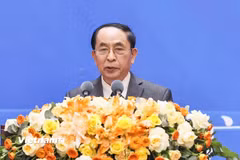 Ông Nguyễn Vinh Quang, Phó Chủ tịch Hội hữu nghị Việt-Trung trình bày tham luận tại Hội nghị. (Ảnh: PV/Vietnam+)