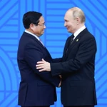 Tổng thống Liên bang Nga Vladimir Putin, Chủ tịch Nhóm BRICS năm 2024 đón Thủ tướng Phạm Minh Chính. (Ảnh: Dương Giang/TTXVN)