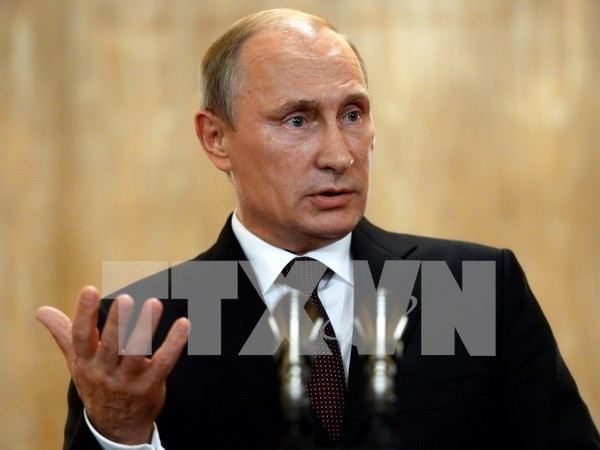 Tổng thống Nga Putin (Ảnh: TTXVN/AFP) Tổng thống Putin: Không ai có thể hăm dọa nước Nga ảnh 1