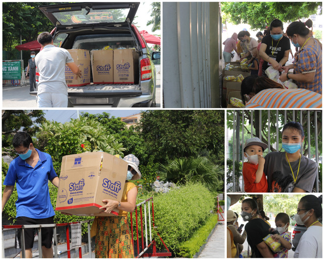 Chị Diệu (áo vàng) xăm xắn trong chuyến vận chuyển đầu tiên. (Ảnh: Minh Anh/Vietnam+) Hà Nội: “Biệt đội bán tải” và những chuyến xe nghĩa tình mùa COVID ảnh 3
