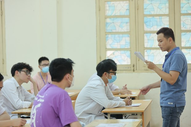 Thí sinh dự thi tốt nghiệp Trung học phổ thông. (Ảnh: PV/Vietnam+) Bộ GD-ĐT chỉ đạo bảo quản bài thi Tốt nghiệp THPT trước bão số 1 ảnh 2