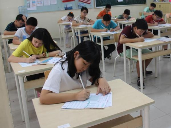 Thí sinh làm bài thi tại Hà Nội. (Ảnh: IIG Việt Nam) Khởi động cuộc thi Vô địch TOEFL Junior 2014 tại Hà Nội ảnh 1