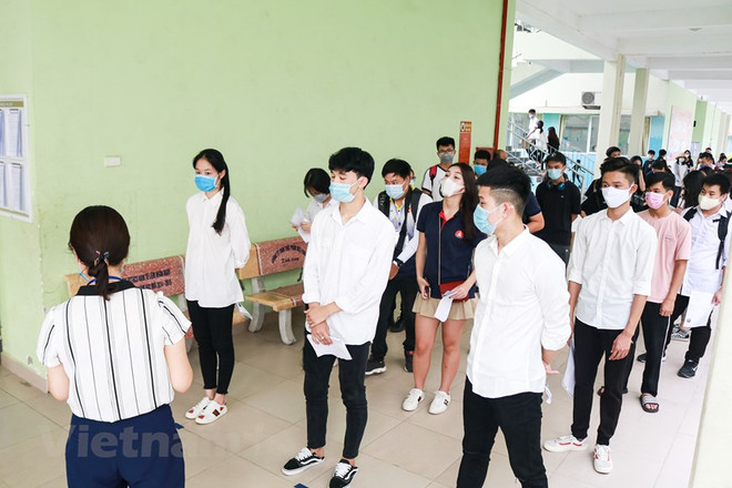 Thí sinh dự tốt nghiệp trung học phổ thông. (Ảnh: PV/Vietnam+) Tuyển sinh đại học năm 2022: Rộng cửa chờ đón thí sinh ảnh 2