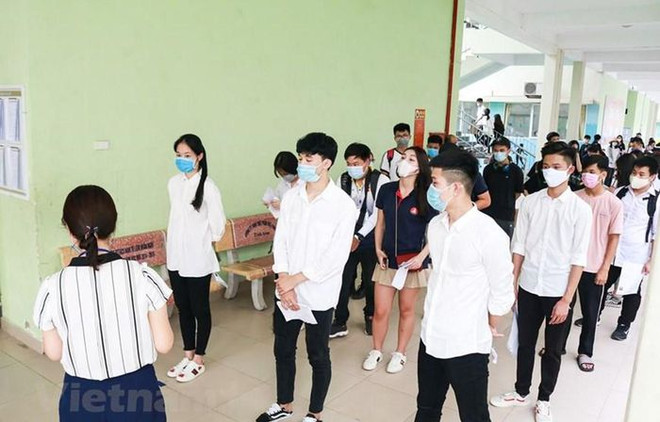 Thí sinh dự thi tốt nghiệp trung học phổ thông năm 2020. (Ảnh: PV/Vietnam+) Các tỉnh vùng dịch ráo riết chuẩn bị cho Kỳ thi tốt nghiệp THPT ảnh 1