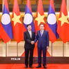 Chủ tịch Quốc hội Trần Thanh Mẫn hội kiến Tổng Bí thư, Chủ tịch nước Lào Thongloun Sisoulith. (Ảnh: Doãn Tấn/TTXVN)