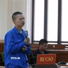 Bị cáo Nguyễn Ngọc Đạo khai báo trước phiên tòa sơ thẩm. (Ảnh: Nguyên Linh/TTXVN)