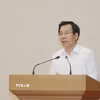 Trưởng Ban Tuyên giáo và Dân vận Tỉnh ủy lào Cai Dương Đức Huy thông tin về Đại hội. (Ảnh: Đinh Thùy/TTXVN)