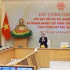 Thủ tướng Phạm Minh Chính làm việc về các giải pháp “phát triển đột phá nhà ở xã hội”. (Ảnh: Dương Giang/TTXVN)