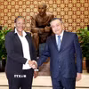Chủ nhiệm Uỷ ban Kiểm tra Trung ương Trần Sỹ Thanh và đồng chí Ana Comoana, Trưởng Ban Kiểm tra Trung ương Đảng Mặt trận Giải phóng Mozambique (FRELIMO). (Ảnh: Phương Hoa/TTXVN)