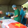 Công tác số hóa, bảo quản mẫu được thực hiện khẩn trương trước khi đưa đi giám định ADN. (Ảnh: Phạm Cường/Vietnam+)