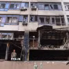 Một toà nhà bị hư hỏng sau vụ không kích của Nga xuống quận Shevchenkivskyi ở Thủ đô Kiev (Ukraine) ngày 21/7/2025. (Ảnh: THX/TTXVN)