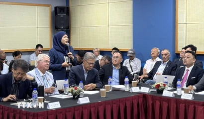 Lãnh đạo doanh nghiệp Malaysia trao đổi tại hội thảo. (Ảnh: Viên Luyến/TTXVN)