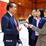 Phóng viên Báo Điện tử VietnamPlus - TTXVN tác nghiệp tại đại hội. (Ảnh: TTXVN)