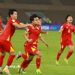 Minh Phúc số 21 ghi bàn ấn định tỷ số 3-2 cho U23 Việt Nam. (Ảnh: Nguồn AFC/TTXVN phát)