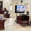 Hình ảnh phiên tòa trực tuyến đầu tiên được mở tại Hà Nội. (Nguồn: laodong.vn)