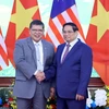 Thủ tướng Phạm Minh Chính với Chủ tịch Hạ viện Malaysia Tan Sri Dato’ Johari Bin Abdul. (Ảnh: Phạm Kiên/TTXVN)