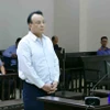 Bị cáo Đỗ Anh Dũng, Chủ tịch Tập đoàn Tân Hoàng Minh khai báo trước tòa. (Ảnh: Phạm Kiên/TTXVN)