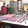 Tang vật bị thu giữ trong chuyên án tại cơ quan điều tra. (Ảnh: TTXVN phát)