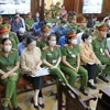 Các bị cáo tại phiên tòa (ngày 13/3). (Ảnh: Thanh Vũ/TTXVN)