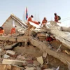 Hoạt động cứu hộ được tiến hành tại hiện trường một vụ động đất ở Trung Quốc. (Ảnh: THX/TTXVN)