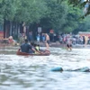 Đường Dương Tự Minh vẫn ngập sâu trong nước (ảnh chụp lúc 6h30 ngày 11/9). (Ảnh: Hoàng Hiếu/TTXVN)