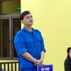 Bùi Vũ Khoa tại phiên tòa. (Ảnh: Huỳnh Anh/TTXVN)