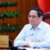 Thủ tướng Phạm Minh Chính chủ trì họp thúc đẩy tiến độ triển khai dự án đường dây 500kv mạch 3 và cung ứng điện tháng cao điểm. (Ảnh: Dương Giang/TTXVN)