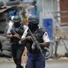 Cảnh sát tuần tra trên đường phố Port-au-Prince, Haiti. (Ảnh: AFP/TTXVN)