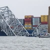 Hiện trường vụ sập cầu Francis Scott Key ở thành phố Baltimore, bang Maryland (Mỹ), sau khi bị tàu chở hàng đâm trúng, ngày 27/3. (Ảnh: AFP/TTXVN)
