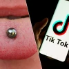 "Thử thách xỏ khuyên" được lan truyền trên mạng xã hội TikTok.. (Ảnh: AFP)