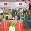 Lễ ký kết biên bản ghi nhớ giữa Chi cục Kiểm lâm, Sở Nông nghiệp và Phát triển Nông thôn tỉnh Thừa Thiên Huế và Chi cục Thanh tra Lâm nghiệp-Sở Nông Lâm tỉnh Sekong, Lào. (Ảnh: TTXVN phát)