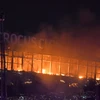 Lửa cháy dữ dội tại hiện trường vụ tấn công nhằm vào trung tâm thương mại “Crocus City Hall” ở Moskva, Nga tối 22/3/2024. (Ảnh: THX/TTXVN)