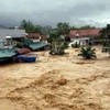 Lũ tràn công trình thuỷ lợi Hà Thanh, xã Đông Hải, huyện Tiên Yên, gây ngập lụt khu dân cư. (Ảnh: TTXVN phát)