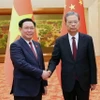Chủ tịch Quốc hội Vương Đình Huệ và Ủy viên trưởng Ủy ban Thường vụ Nhân đại toàn quốc Trung Quốc Triệu Lạc Tế. (Ảnh: Nhan Sáng/TTXVN)