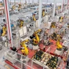 Bên trong nhà máy sản xuất xe điện ở tỉnh Chiết Giang, Trung Quốc. (Ảnh: THX/TTXVN)