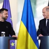 Tổng thống Ukraine Zelensky và Thủ tướng Đức Olaf Scholz. (Ảnh: Reuters)