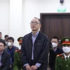 Bị cáo Đỗ Quốc Hùng (cựu Giám đốc BIDV chi nhánh Thành Đô) tại tòa. (Ảnh: Kim Anh/TTXVN)