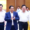Thủ tướng Phạm Minh Chính đến Hội nghị Thủ tướng Chính phủ làm việc với doanh nghiệp nhà nước. (Ảnh: Dương Giang/TTXVN)