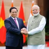 Thủ tướng Phạm Minh Chính và Thủ tướng Ấn Độ Narendra Modi. (Ảnh: Dương Giang/TTXVN)
